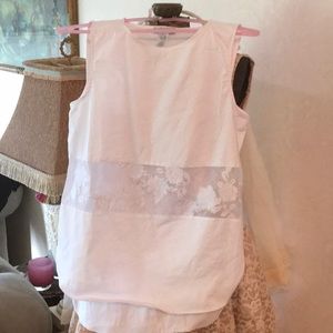 Sleeveless white cotton shirt
